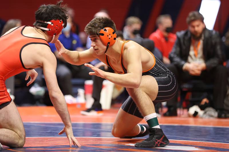 Crystal Lake Central’s Dillon Carlson works against Deerfield’s Benjamin Shvarsman in the Class 2A 160lb. championship match at State Farm Center in Champaign. Saturday, Feb. 19, 2022, in Champaign.