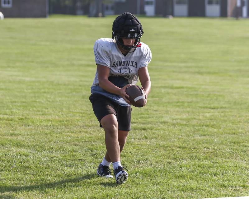 Cash White practices punting during Sandwich football practice Tuesday, July 22, 2025 in Sandwich.