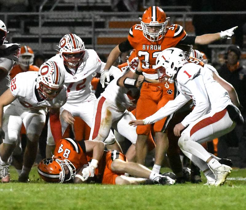 Byron's Zion Gautier (84) recovers an Oregon fumble as his teammate Ben Hiveley (33) reacts to the play on Friday, Oct. 31, 2025 in the first round of the 3A state playoffs held at the Everett Stine Stadium in Byron. The Tigers won the game 63-15.