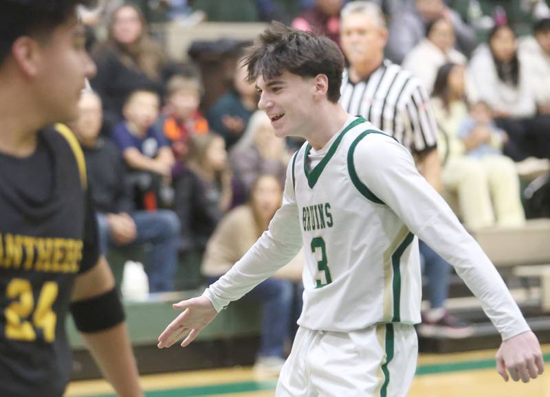 St. Bede's Alec Tomsha hi-fives temmate Geno Dinges after scoring against Putnam County during the Class 1A Regional quarterfinal game on Monday, Feb. 23, 2026 at St. Bede Academy.