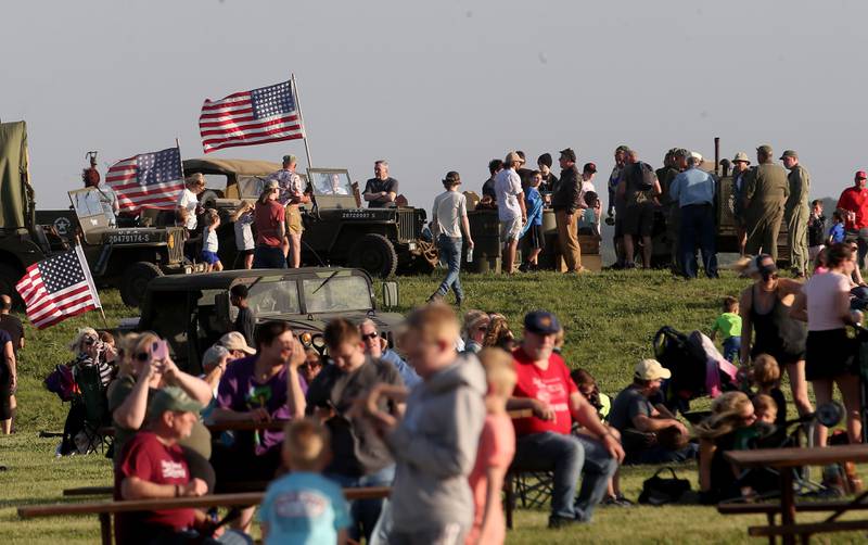Military personnel gather to watch planes during the 10th annual TBM Avenger Reunion and Airshow on Friday, May 16, 2025 at the Illinois Valley Regional Airport in Peru.