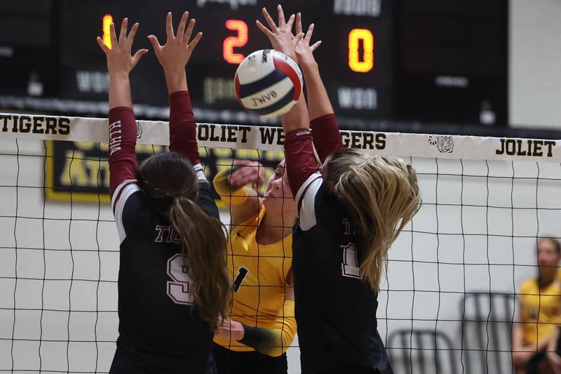 Joliet West’s Ava Grevengoed finds a sliver in the defense of Plainfield North for the point on Wednesday, Sept. 6, 2023 in Joliet.