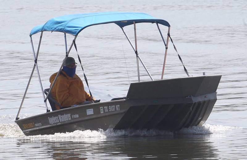 71 year old adventurer and thyroid cancer survivor Robert Youens, passes through the Starved Rock Lock and Dam on Monday, July 28, 2025 near Utica. Youens is making  the Great Loop, a 6,000 mile journey on his Jon boat something that hasn't been done before. Youens is looking at setting a record for the longest someone has gone on a Jon boat.