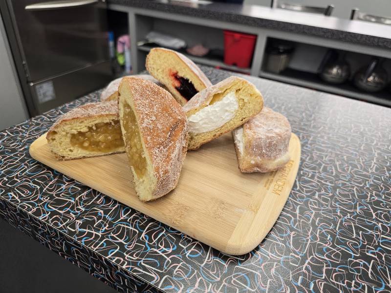 A variety of Paczki, a traditional jelly-filled, doughnut-like pastry, which many people enjoy before the start of Christian Lent, is seen at Home Cut Donuts in Joliet on Saturday, Feb. 14, 2026.