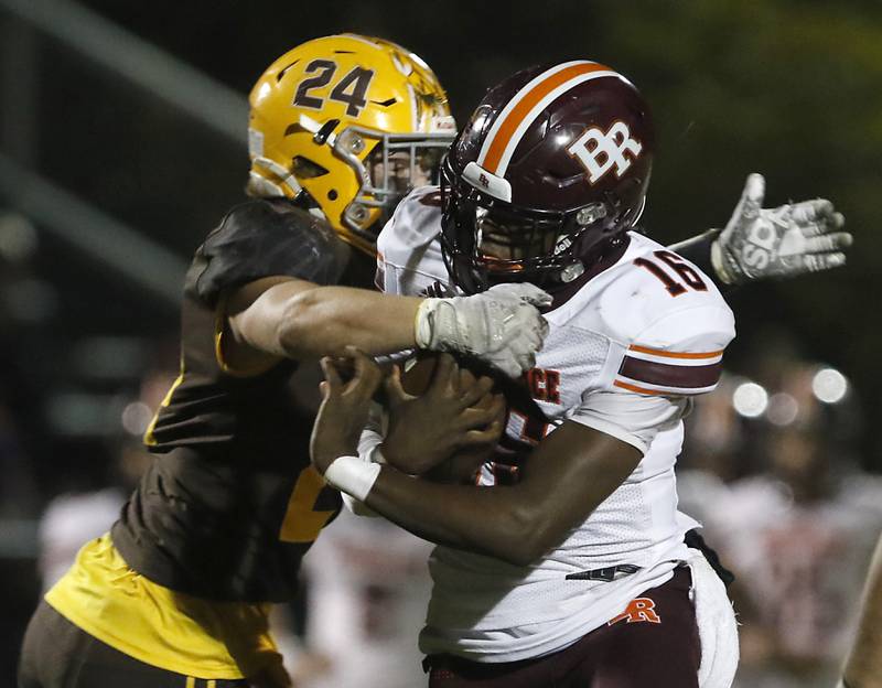 Jacobs' Dino Hunt tries to tackle Brother Rice's Marcus Brown during a IHSA Class 7A first round playoff football game Friday, Oct. 28, 2022, between Jacobs and Brother Rice at Jacobs High School in Algonquin.