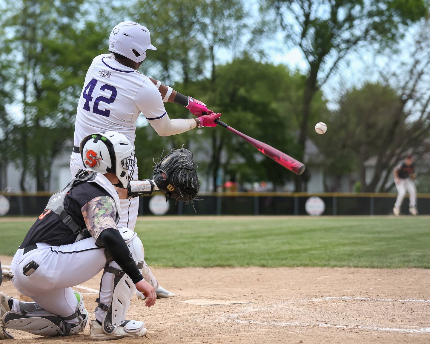 Plano's Jason Phillips (42) hits a pitch during baseball game between Sandwich at Plano.  May 8, 2024