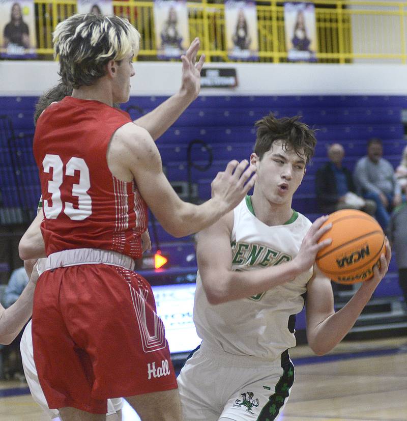 Seneca’s Brady Sheedy pulls down this rebound ahead of Hall’s Braden Curran in the 1st period Monday at the Serena Huskers Hardwood Tip-Off Tournament.