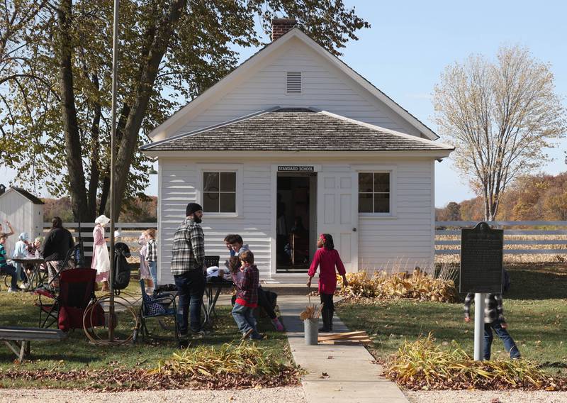 Southeast Elementary School third graders mill about as they get ready for lunch Tuesday, Nov. 4, 2025, during a visit to North Grove School, a one-room schoolhouse from 1878 in Sycamore.