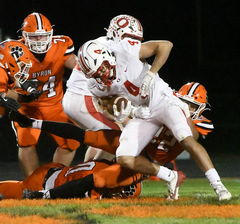 Oregon's Jakobi Donegan (4) fights for yards against Byron in 3A football playoff action on Friday, Oct. 31, 2025 at the Everett Stine Stadium in Byron.