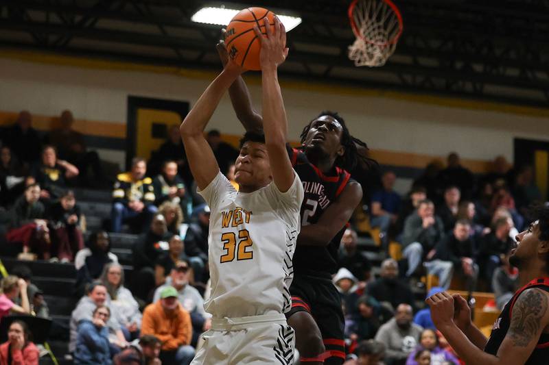 Joliet West’s Ethan Hillsman pulls in the rebound against Bolingbrook on Friday, Jan 24, 2025 in Joliet.