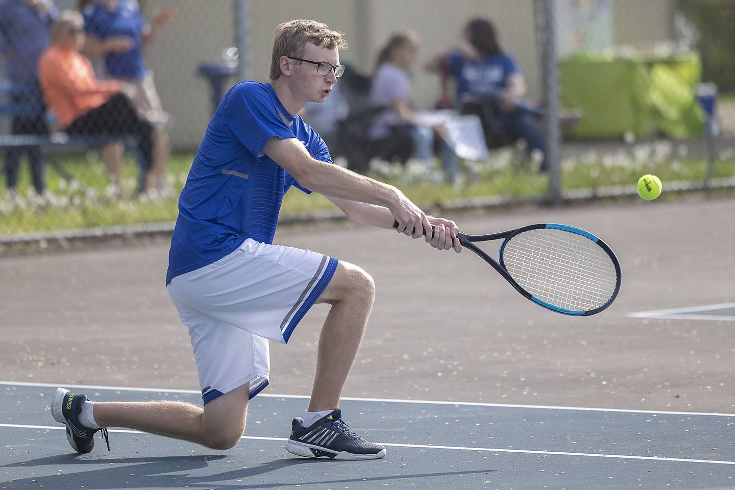 Newman’s Carson Palmer returns a shot against Dixon while playing doubles Tuesday, May 9, 2023.