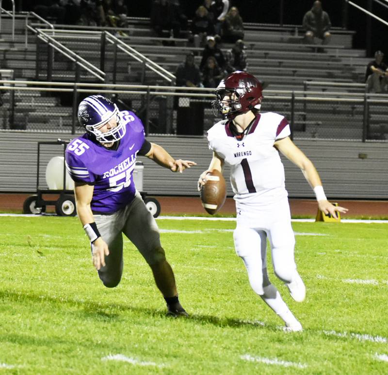 Marengo quarterback David Lopez looks to evade Rochelle defender Kaiden Morris during Kishwaukee River/Interstate 8 Blue Division game Friday night.