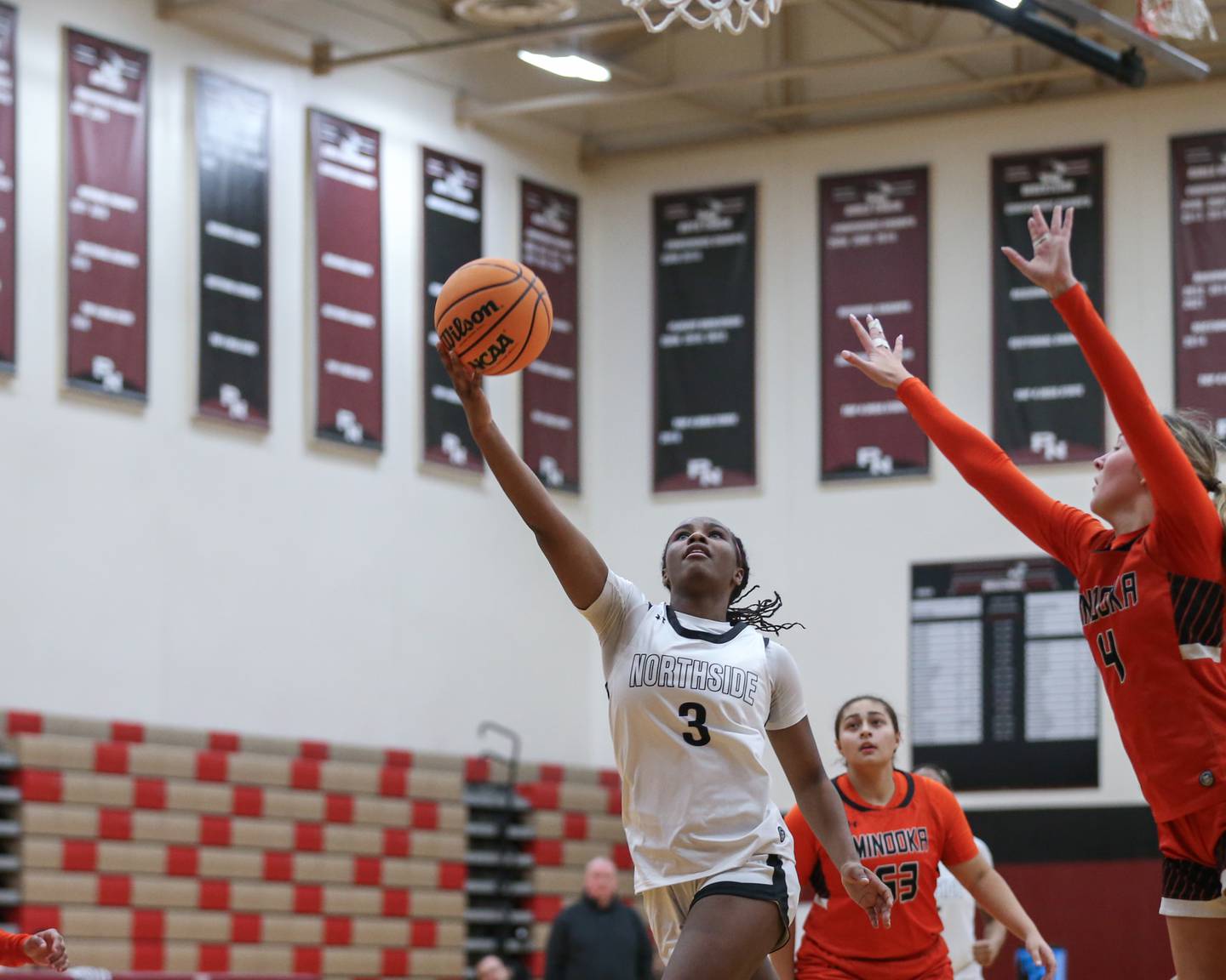 Plainfield North's Taylor Henderson (3) puts up scoop shot during their basketball game between Minooka at Plainfield North. Feb 06, 2025 in Plainfield.