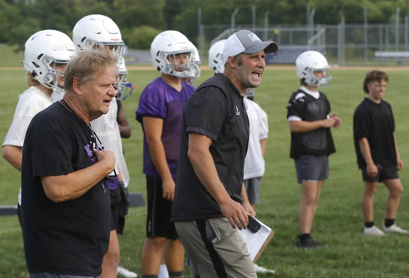 Hampshire football assistant coach Tim Haak and head coach Shane Haak watch a play during the first day of football practice Monday, August 7, 2023, at Hampshire High School.