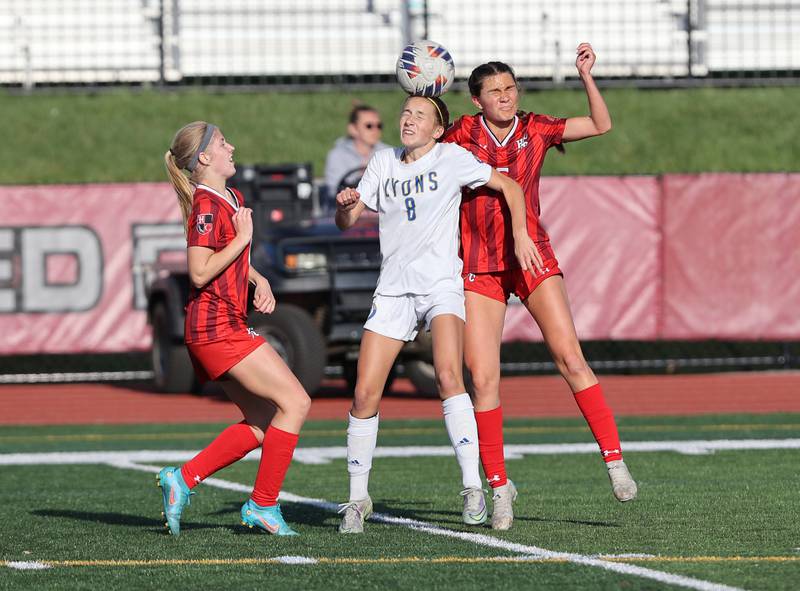 Lyons Township's Carolina Capizzi (8) and Hinsdale Central's Julia Marinaccio (6) go up for the ball during the girls varsity soccer match between Lyons Township and Hinsdale Central high schools in Hinsdale on Tuesday, April 18, 2023.