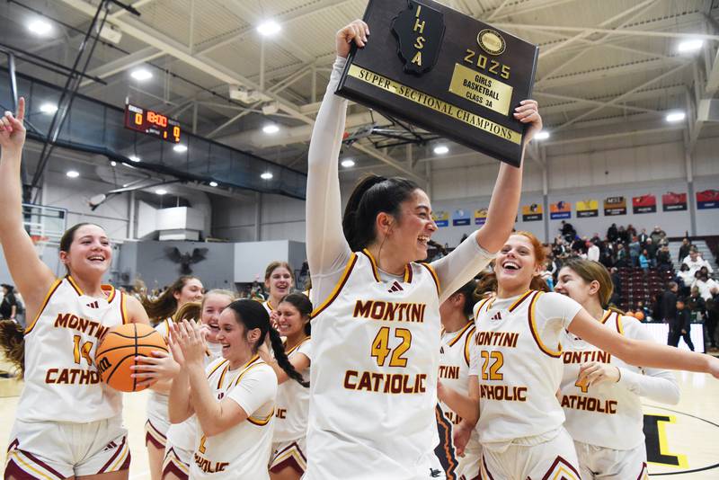 Montini players including Natalie Gartlan, middle, Miley Brunski, left, and Audrey Kinney, right, celebrate their 51-45 victory over Grayslake Central during the Hersey Class 3A supersectional on Monday, March 3, 2025 in Arlington Heights.