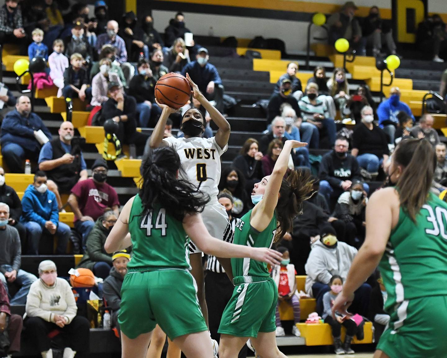 Joliet West Tigers Lisa Thompson (0) shoots 3pt shot against Providence Celtics on Thursday, Feb. 10, 2022, at Joliet .