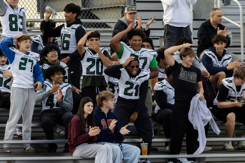 Plainfield Central’s boys varsity football team supports the girls flag football team during the IHSA Danville Sectional varsity flag football game against Yorkville at Plainfield East on Oct. 13, 2025.
