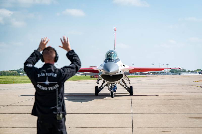 The painted F-16 Fighting Falcon piloted by U.S. Air Force Maj. Taylor "FEMA" Hiester, F-16 Viper Demonstration Team commander and pilot and marshaled by Tech. Sgt. Joshua Butcher, F-16 VDT maintenance non-commissioned officer in charge arrived at Peru Municipal Airport on Thursday, May 15 2025.