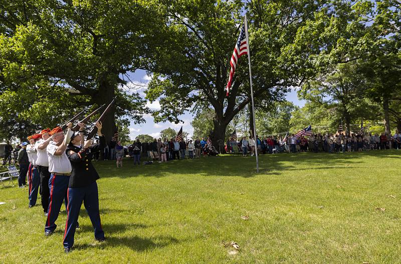Members of the Marine Corps League fire a volley Monday, May 27, 2024 as the playing of taps is performed at Oakwood Cemetery.