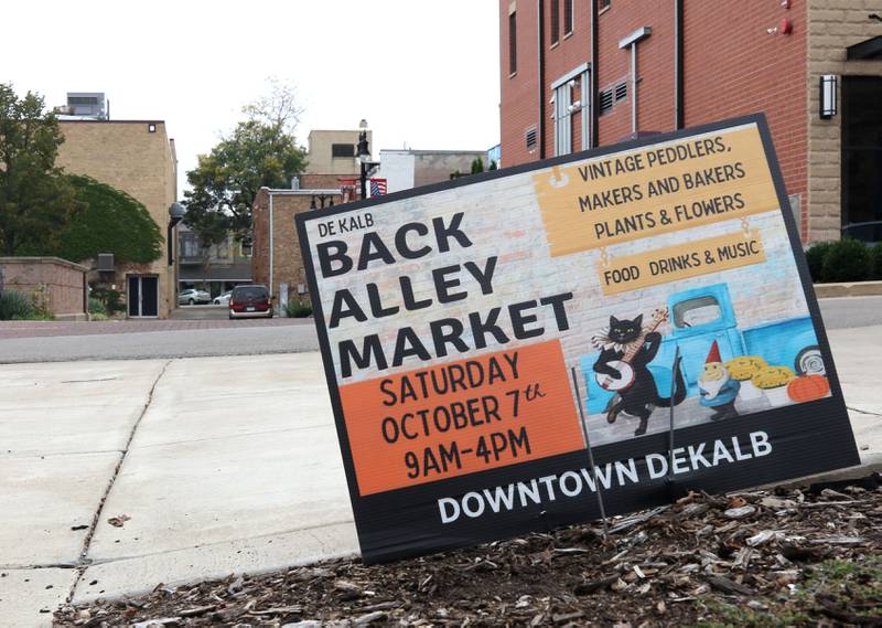 A sign promoting this weekend’s Back Alley Market near the alley behind Frank Van Buer Plaza Wednesday, Oct. 4, 2023, in DeKalb.