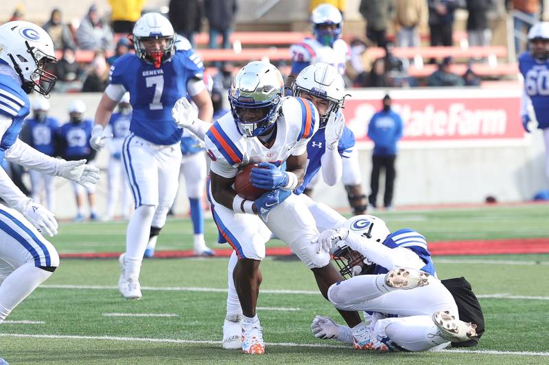 East St. Louis’ Ronnie GoMiller spins out of a tackle against Geneva in the Class 6A state championship on Saturday, Nov. 30, 2024 in Normal.
