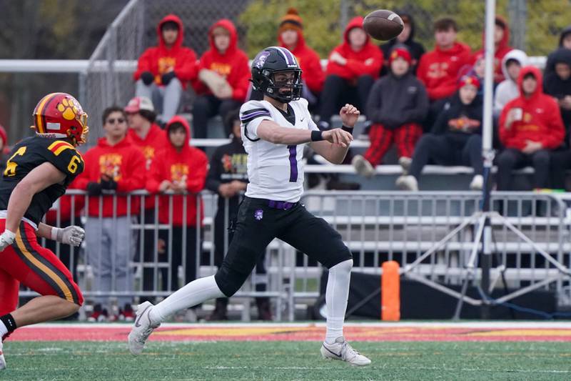 Downers Grove North's Owen Lansu (1) throws a pass against Batavia during a class 7A quarterfinal playoff football game at Batavia High School on Saturday, Nov. 16, 2024.