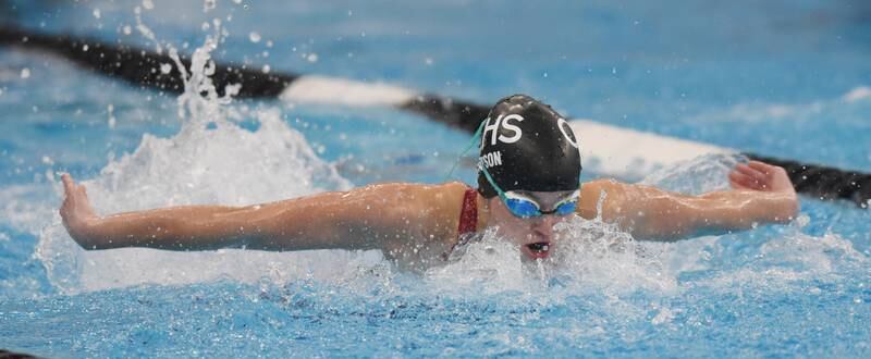 Crystal Lake South's Avery Watson swims in the consolation heat of the 100-yard butterfly during the IHSA girls state swimming finals at FMC Natatorium in Westmont on Saturday, Nov. 12, 2022.