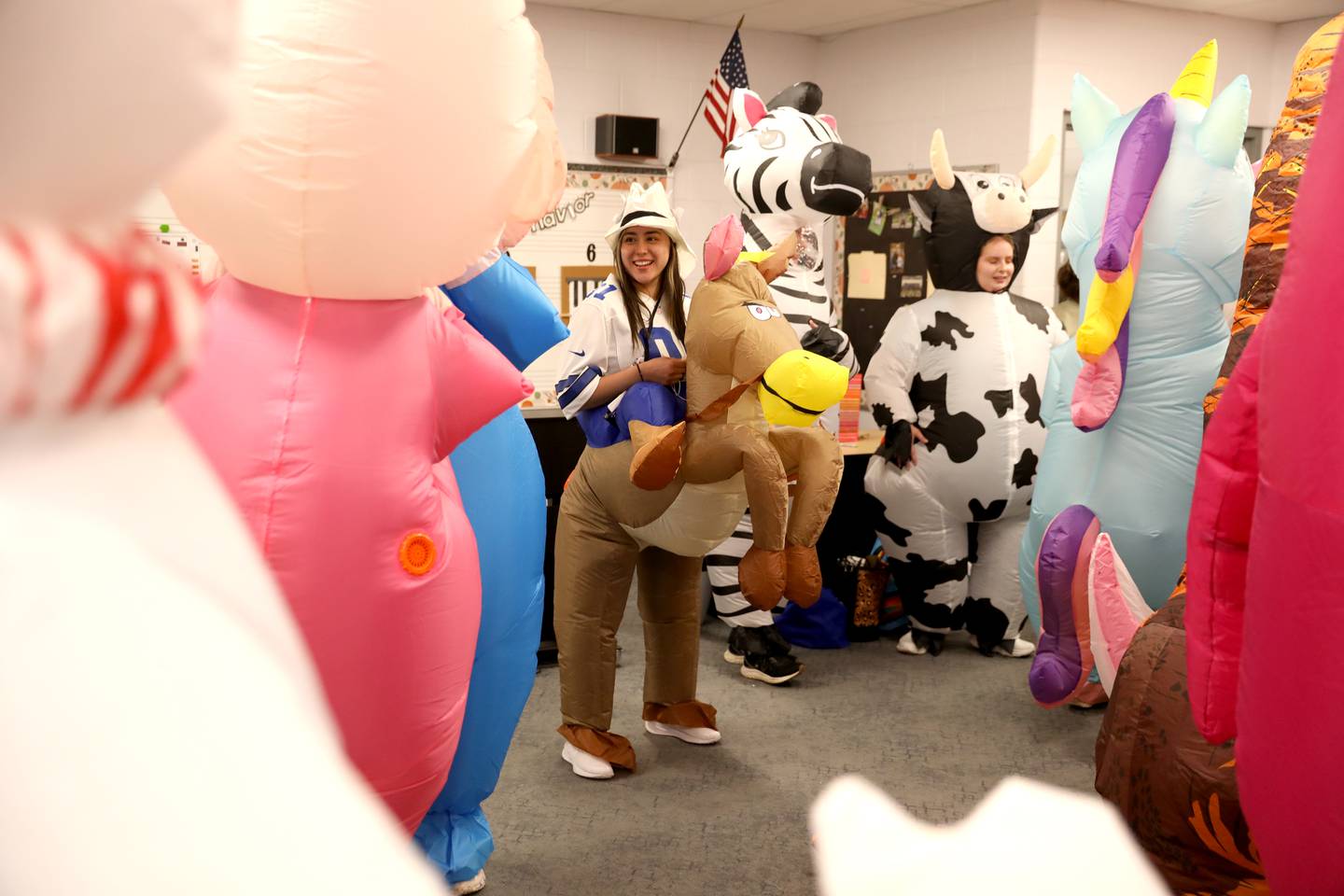 Angelina Solano, as a cowboy on a horse, and other teachers and staff members surprised students at Emily G Johns Elementary School in Plano with an inflatables race on Tuesday, May 27. 2025 after the all-school field day to celebrate the end of the school year.