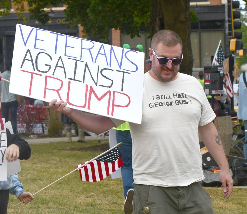 There were a variety of signs carried by demonstrators on Saturday, Oct. 18, 2025 at the No Kings rally on the Ogle County Courthouse square in Oregon, Illinois to protest actions and decisions by President Donald Trump and his administration.