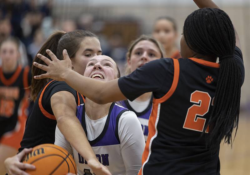 Dixon’s Addy Lohse works below the basket against Byron Saturday, Dec. 27, at the Duchesses Basketball Christmas Classic.