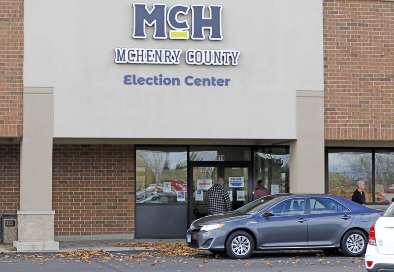 People enter and leave the  the McHenry County Election Center on Thursday Oct, 31, 2024, in Woodstock.