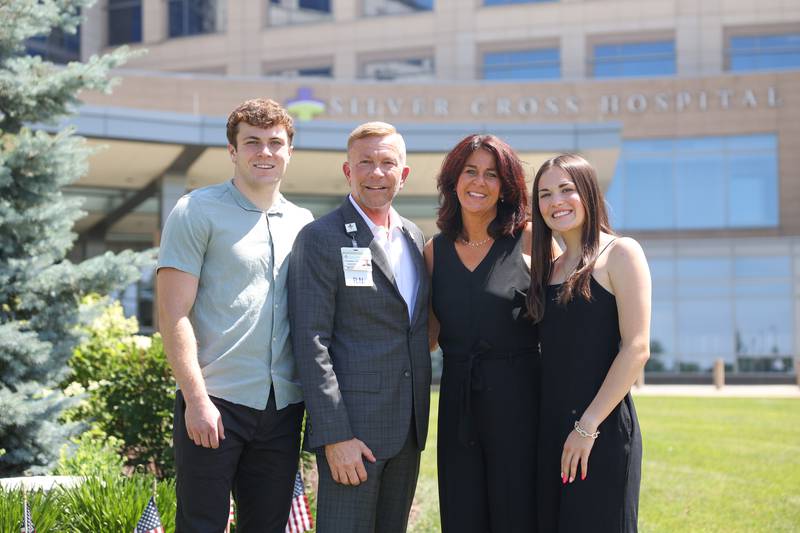 New President and CEO of Silver Cross Hospital Michael Mutterer poses for a family photos with his son Evan, wife Nancy and daughter Emersyn on Wednesday June 12, 2024 in New Lenox.