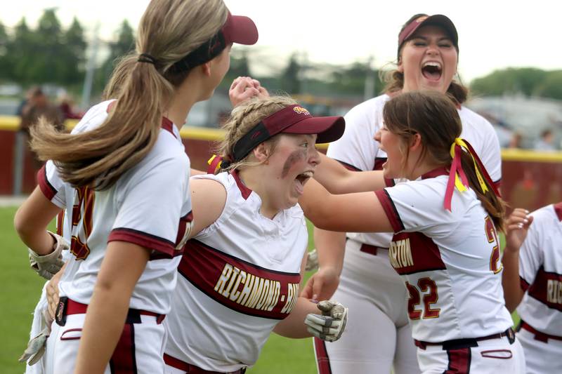 Richmond-Burton’s (from left to right) Mia Spohr, Lyndsay Regnier, Gabby Hird and Norah Spittler (back right) celebrate a win over Stillman Valley in the Class 2A Richmond-Burton Sectional final on Friday in Richmond.
