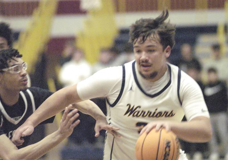 Sterlings Maddux Osborn drives the ball against Galesburg. Sterling Boys Basketball hosted Galesburg at Musgrove Fieldhouse on February 11, 2025.
