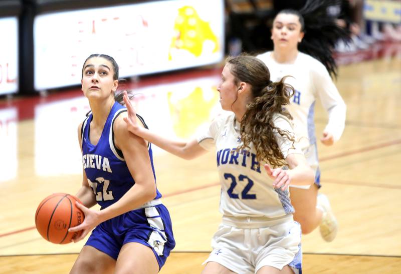 Geneva’s Leah Palmer looks for her shot away from St. Charles North’s Katrina Stack during a Class 4A Batavia Sectional semifinal game on Tuesday, Feb. 20, 2024.