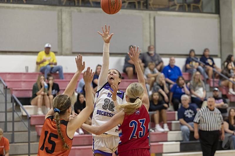 Dixon’s Harvest Day splits a pair of defenders Thursday, June 15, 2023 during the Sauk Valley Media All-Star Basketball Classic at Sauk Valley College.