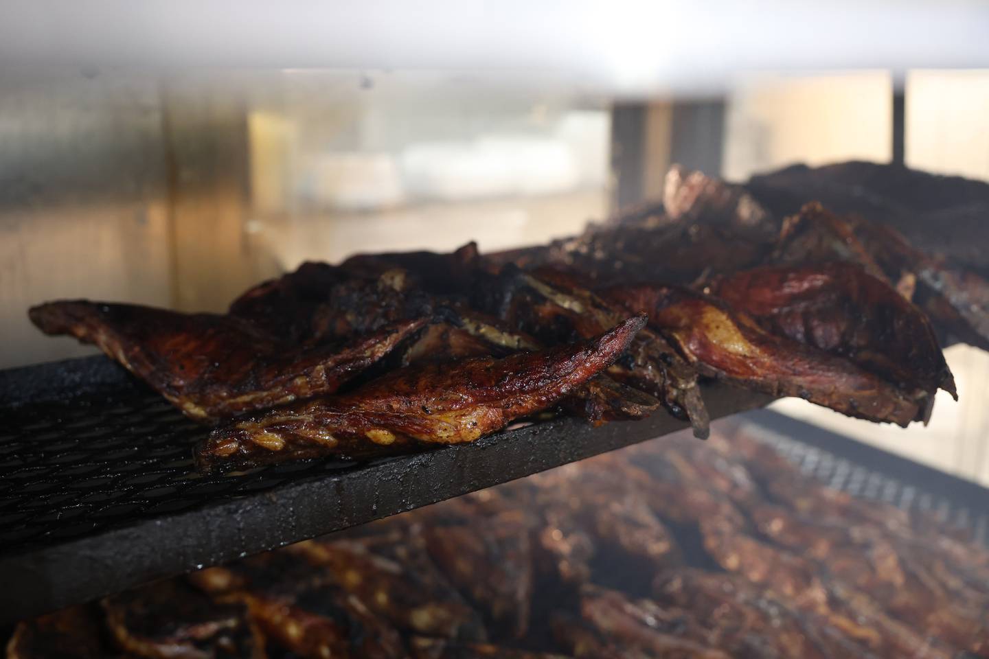 Rib tips that have been cooking for three hours in the aquarium cooker wait to be cut up at Chicago Style BBQ on Wednesday, May 29, 2024 in Joliet.