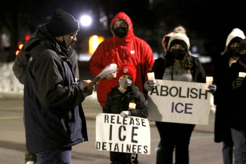 Activists held a candlelight march to the front of the McHenry County Correctional Facility the evening of Wednesday, Dec. 29, 2021, using a bullhorn to offer encouraging words to inmates and detainees. Former detainee Cesar Elizarraraz spoke to those gathered as part of the event arranged by the Coalition to Cancel the ICE Contract in McHenry County.
