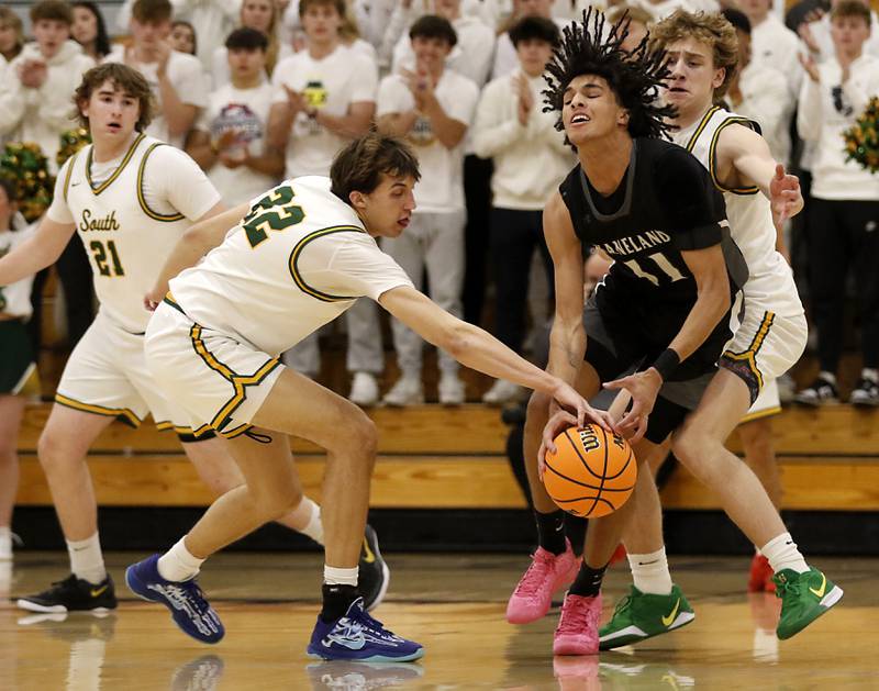 Crystal Lake South's Anthony Santarelli steals the ball from Kaneland's Evan Frieders as Crystal Lake South's Vincent Santarelli defends during the IHSA Class 3A Rochelle Sectional championship basketball game on Friday, March 7, 2025, at Rochelle High School.