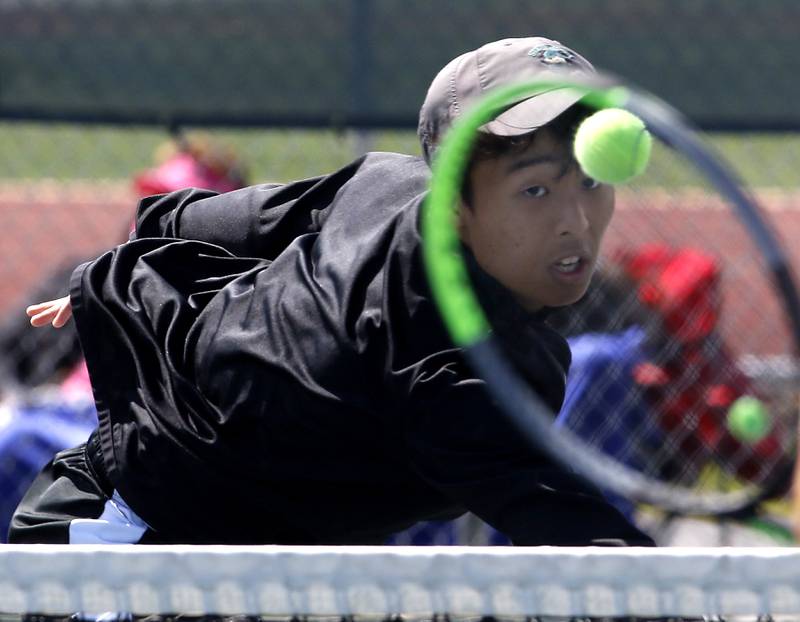 Stevenson's Yunseong Jang returns the ball during an IHSA 2A boys doubles tennis match Thursday, May 25, 2023, at Buffalo Grove High School.