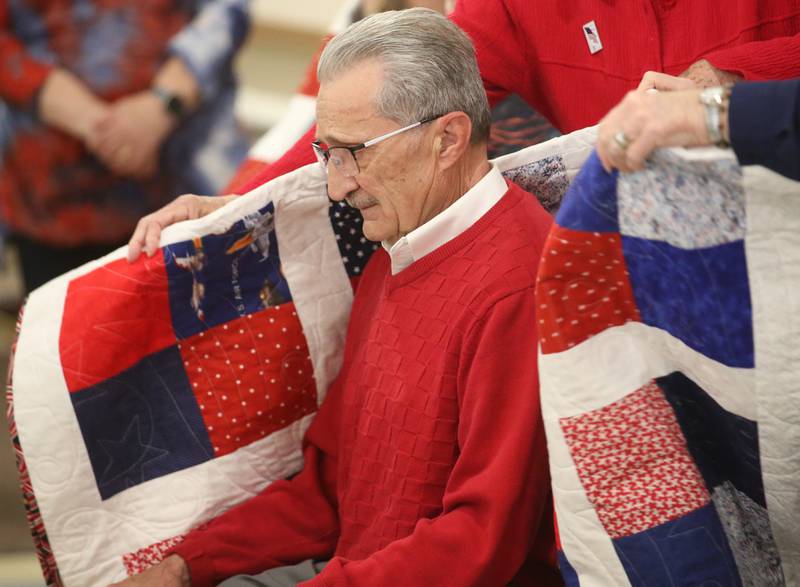 Phillip Valley of La Salle, receives his quilt during the Quilt of Valor ceremony on Saturday, April 19, 2025 at the Moose Lodge in Princeton.
