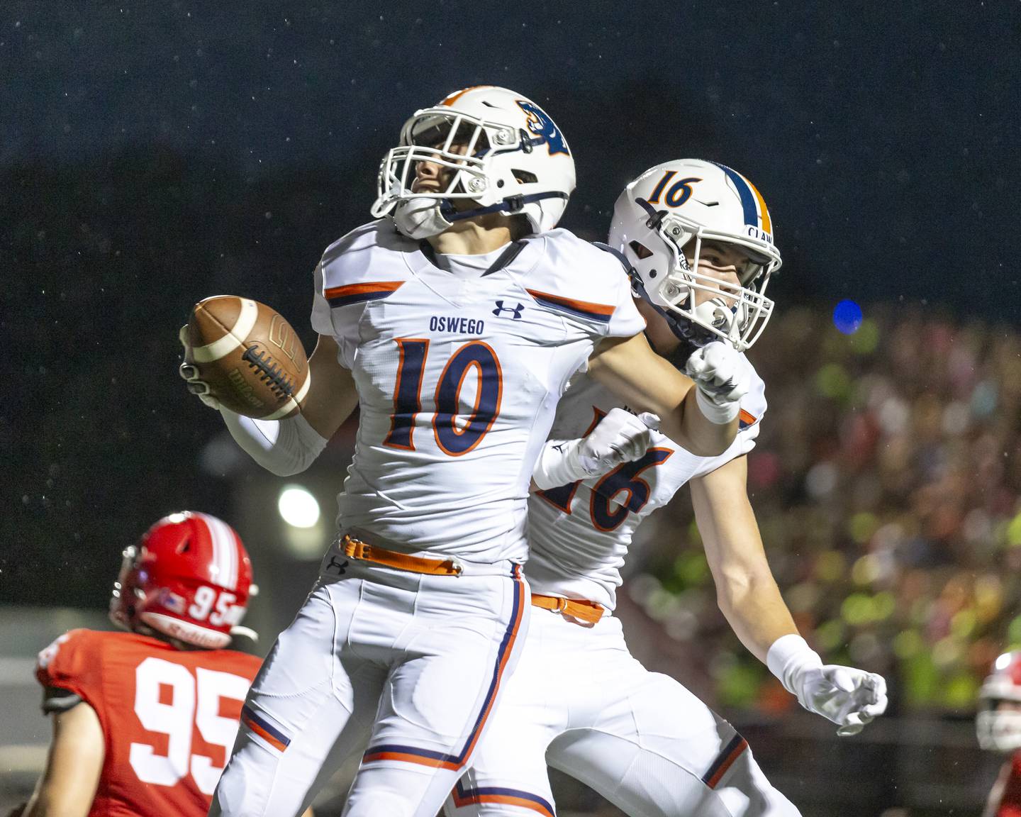 Oswego's Mariano Velasco (10) celebrates his touchdown run after catch during football game between Oswego at Naperville Central  on Friday, Aug 29, 2025  in Naperville.