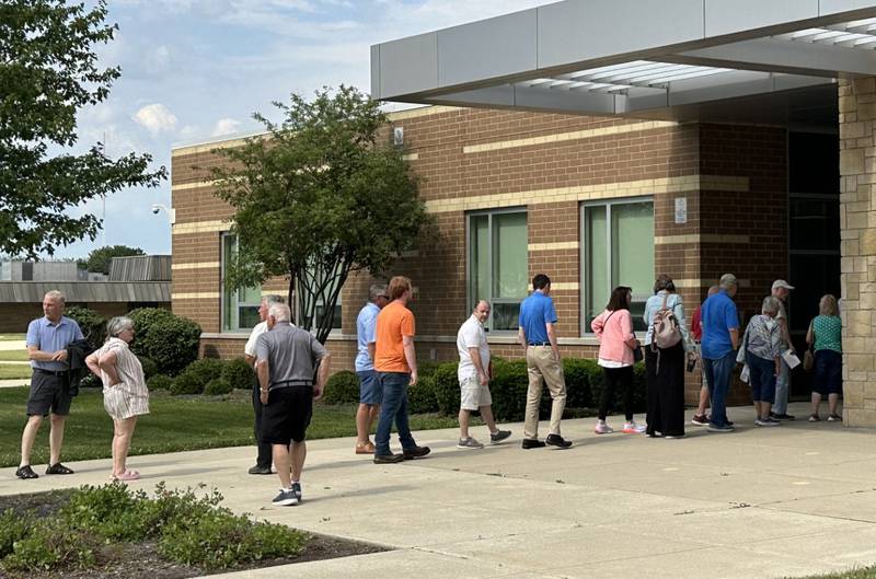 A long line of people wait to enter Central Intermediate School during a hearing  about OSF on Thursday, June 13, 2024 at Central Intermediate School in Ottawa.