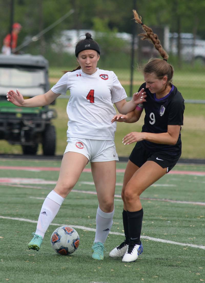Glenbard East's Jasmine Dhamers keeps the ball from Downers Grove North's Rachel Wilson during the regional final game held Friday May 20, 2022.