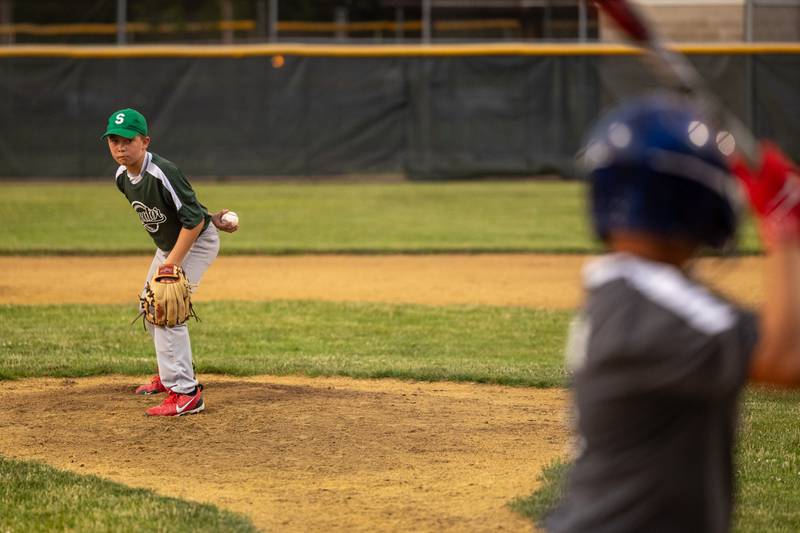 Rhett Lepper (11) of Hatzer & Sons looks to pitch Wednesday, June 25, 2025, at Southside Park in Streator.