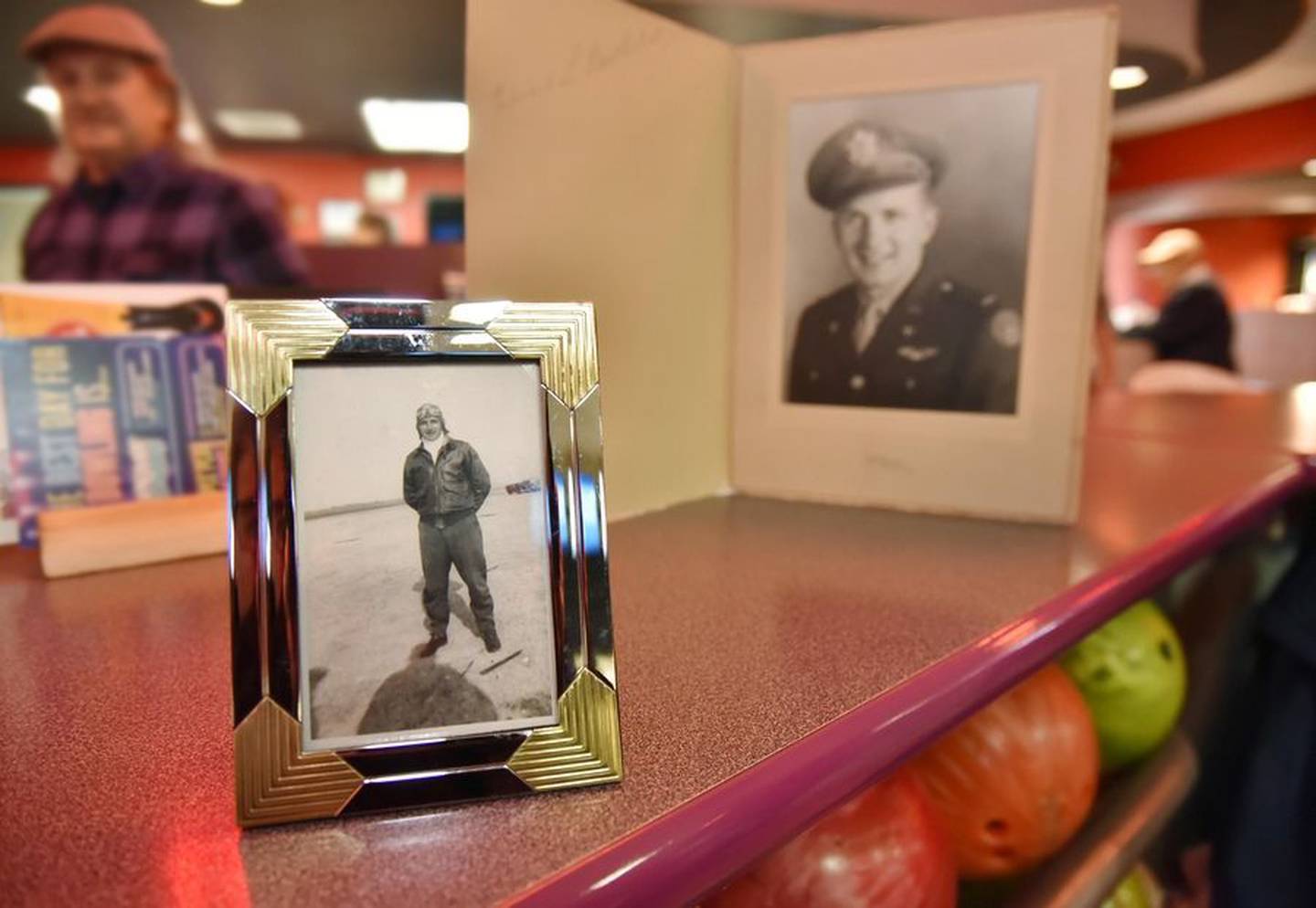 Two photos of 103-year-old Ed Berthold, taken when he served in the Army Air Corps during World War II, were on display this week for a birthday celebration at Bowlero in Deer Park.