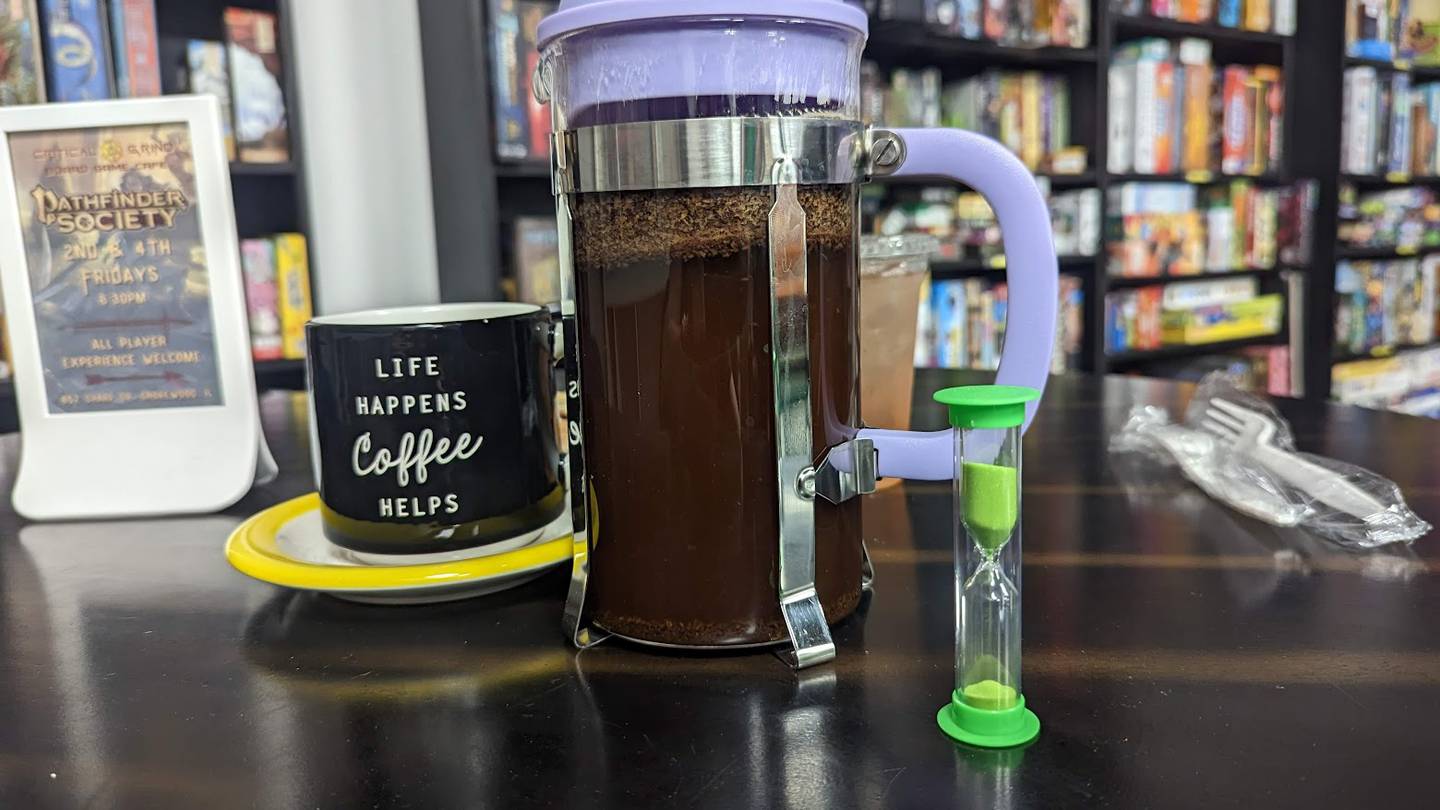 French press coffee with a timer is seen at Critical Grind Board Game Cafe in Shorewood on Sunday, May 21, 2023.