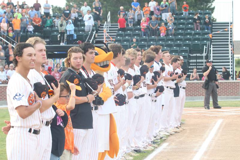 Illinois Valley Pistol Shrimp players stand for the National Anthem on Wednesday, Aug. 2, 2023 at Schweickert Stadium on Tuesday, Aug. 2, 2023 in Peru.