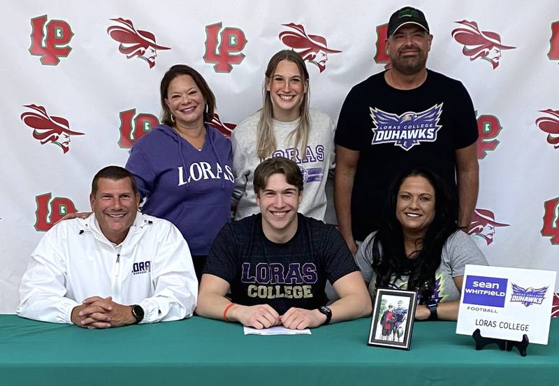 La Salle-Peru's Sean Whitfield (seated, center) will continue his football career at Loras College. He was joined by his mom, Christine Kramoski (seated, right), his dad, Sean Whitfield (seated, left) and standing left to right, Leah Hoppes, Emma Happ and Darin McElfresh.